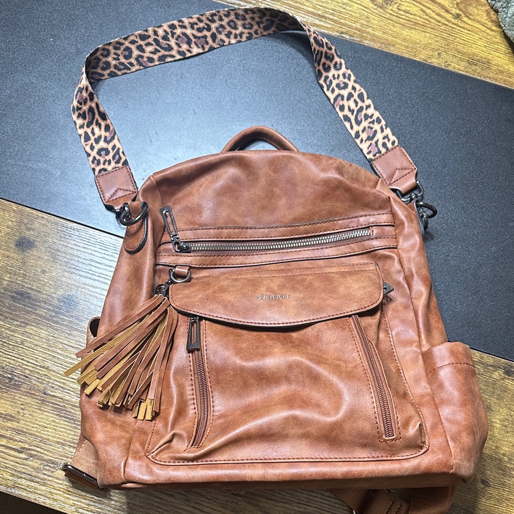 Stylish Tan Leather Backpack with Leopard Strap